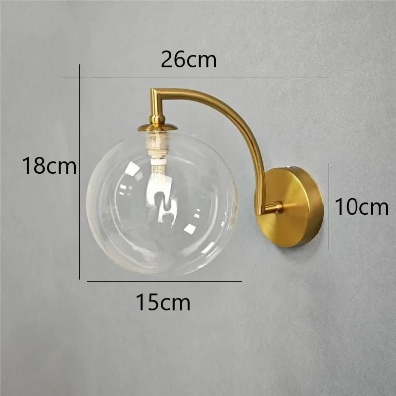 Modern Brass Wall Light | Curved Arm Sconce with Clear Glass Globe