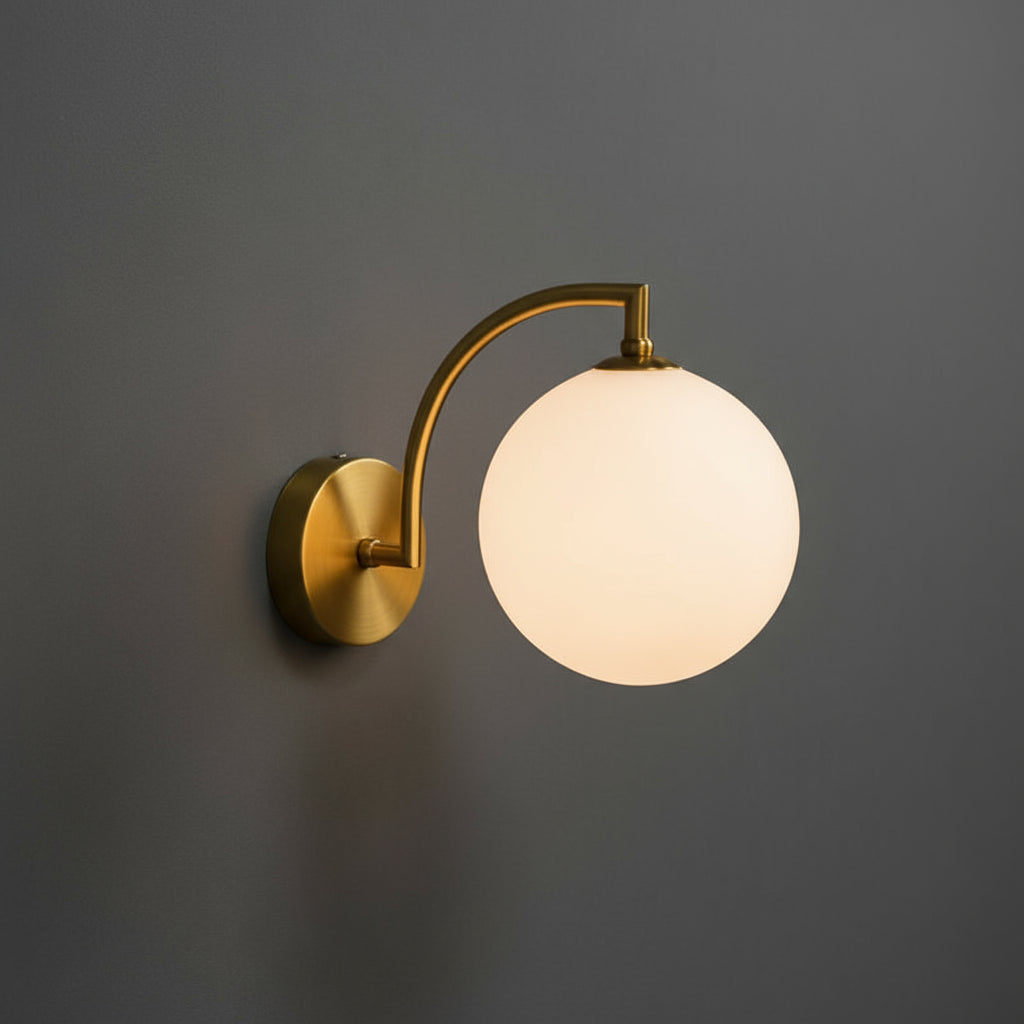 Modern Brass Wall Light | Curved Arm Sconce with Clear Glass Globe