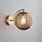 Art Deco Wall Light | Fluted Glass Globe Sconce with Curved Brass Arm
