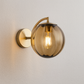 Art Deco Wall Light | Fluted Glass Globe Sconce with Curved Brass Arm