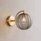 Art Deco Wall Light | Fluted Glass Globe Sconce with Curved Brass Arm