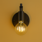 Industrial Wall Light | Black Iron Round Backplate with Curved Arm Open Bulb Design