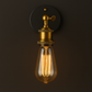 Antique Brass Wall Light | Adjustable Exposed Bulb Sconce with Black Round Wall Plate