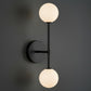 Antique Brass Wall Light | Vertical Double Globe Sconce with Frosted Glass Shades