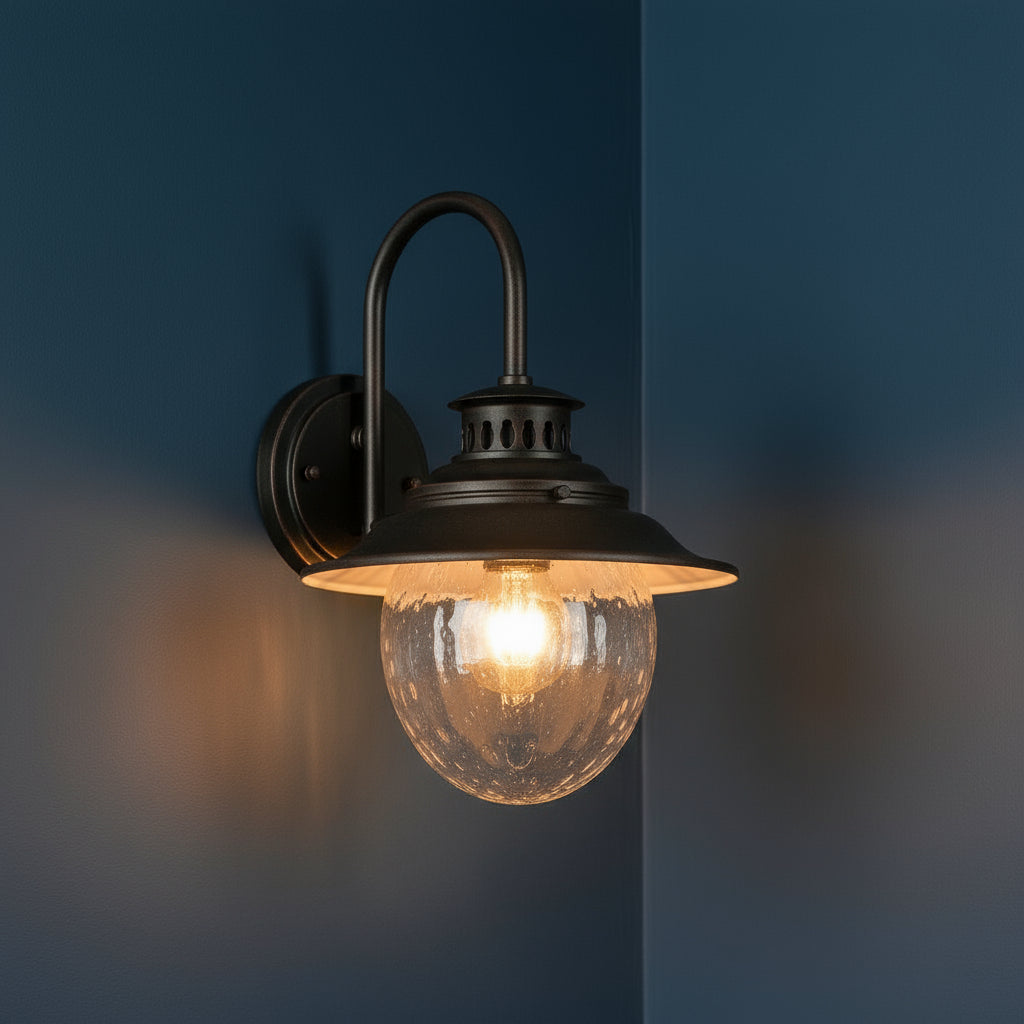 Antique Brass Outdoor Wall Light | Industrial Lantern-Style Sconce with Curved Arm and Hammered Glass Shade