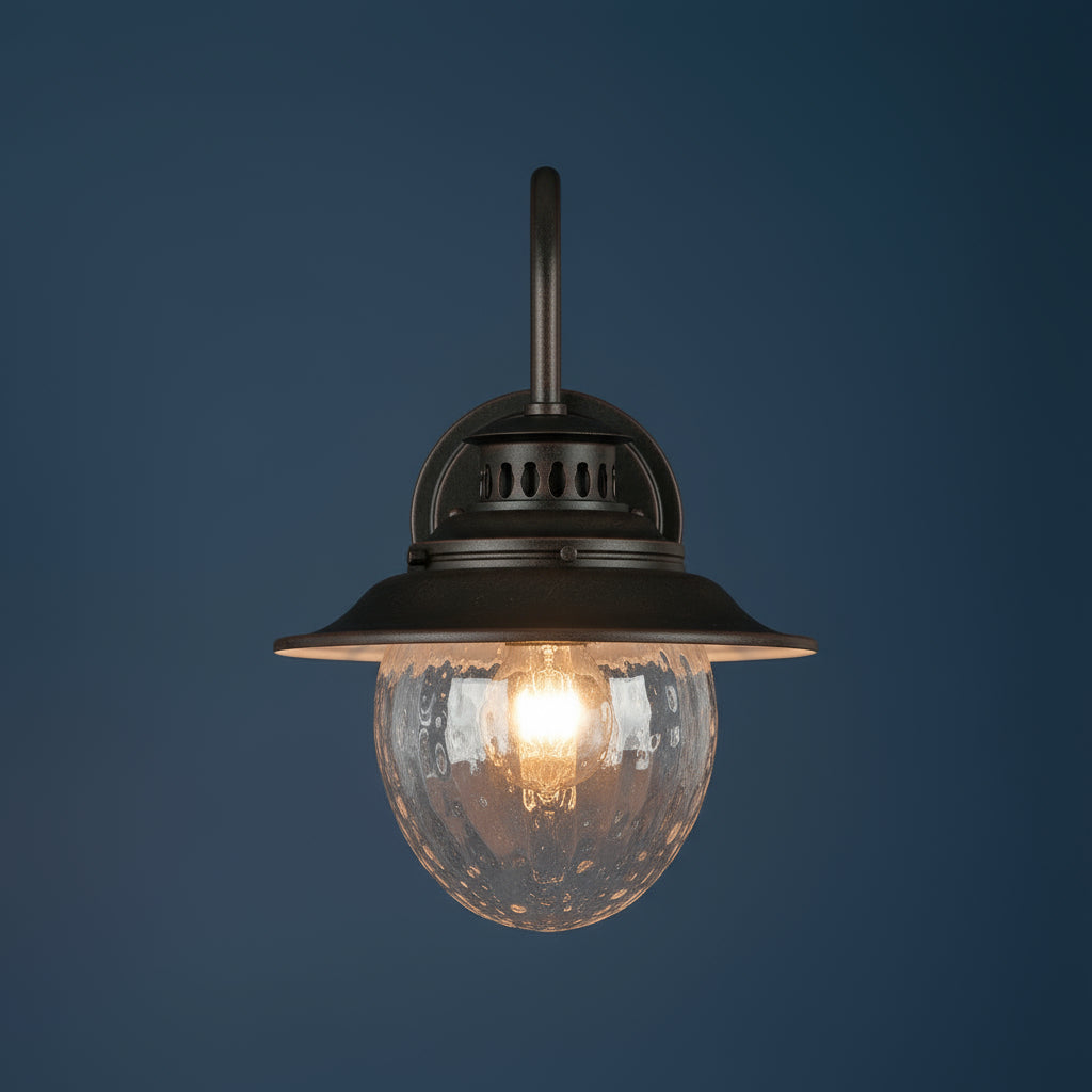 Antique Brass Outdoor Wall Light | Industrial Lantern-Style Sconce with Curved Arm and Hammered Glass Shade